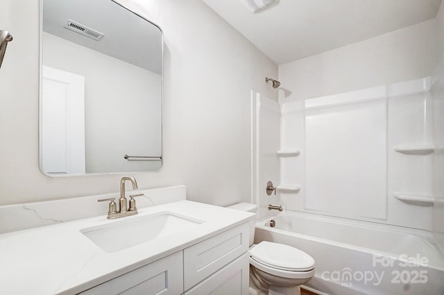 full bathroom featuring shower / washtub combination, vanity, and toilet