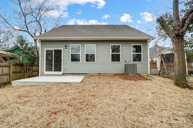 rear view of house featuring a patio and central AC