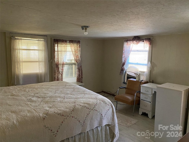 bedroom with light wood-type flooring