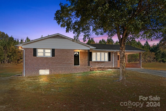 view of front of home with a yard