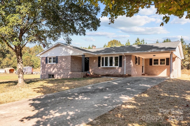 ranch-style house with a carport