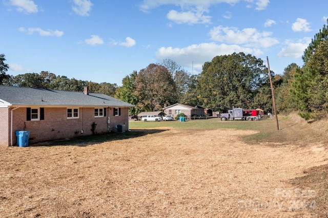 view of yard featuring central AC unit