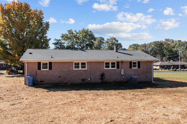 rear view of house with central air condition unit