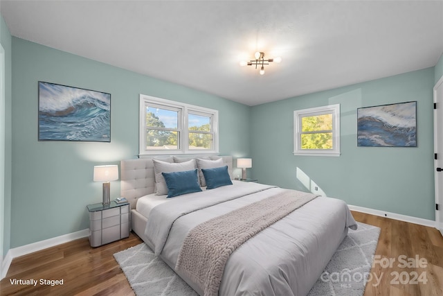 bedroom with hardwood / wood-style floors