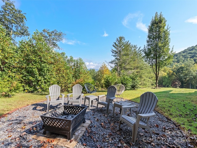 view of patio / terrace featuring a fire pit