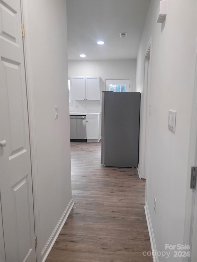 corridor featuring dark wood-type flooring