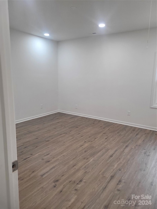 unfurnished room featuring wood-type flooring