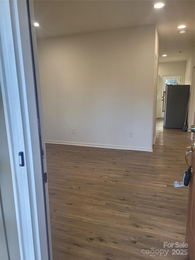 empty room featuring dark hardwood / wood-style floors