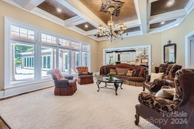 living room with an inviting chandelier, beamed ceiling, and coffered ceiling