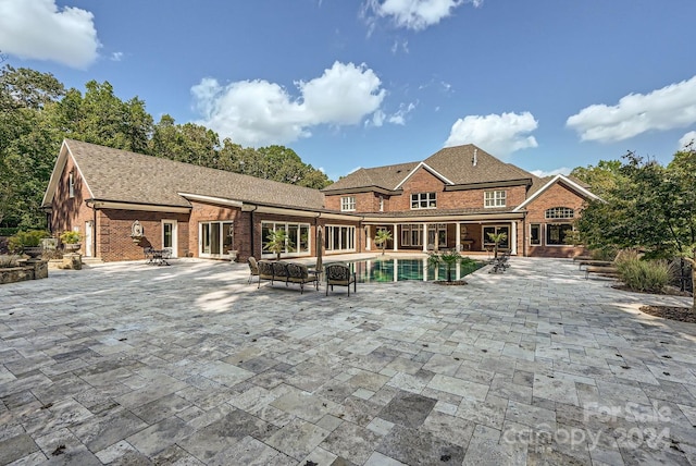 rear view of house with a patio