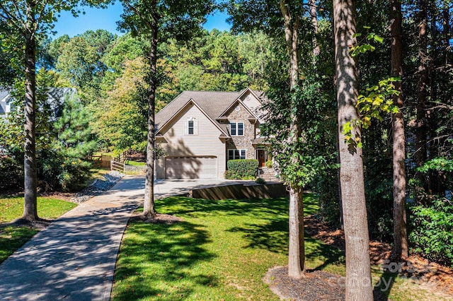 3905 Granite St, Terrell, NC 28682 - view of front facade with concrete driveway, a garage, and a front lawn