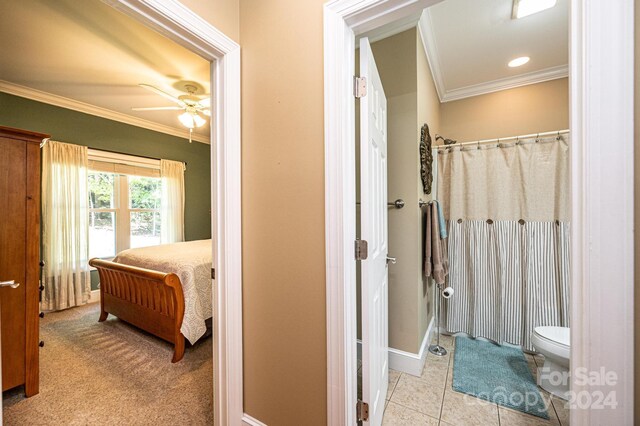 3905 Granite St, Terrell, NC 28682 - bathroom with crown molding, toilet, a ceiling fan, baseboards, and a shower with shower curtain
