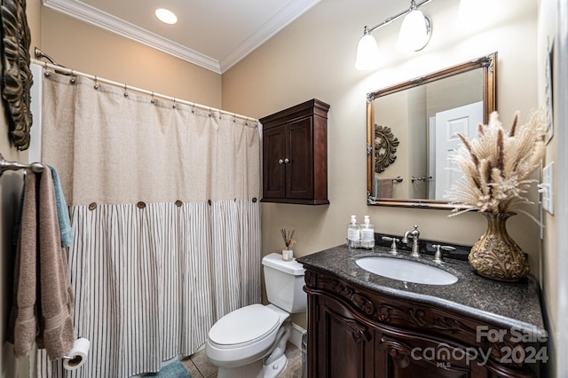 bathroom featuring toilet, ornamental molding, vanity, and tile patterned floors