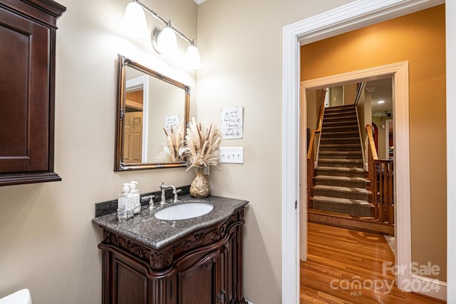 bathroom with vanity and hardwood / wood-style floors