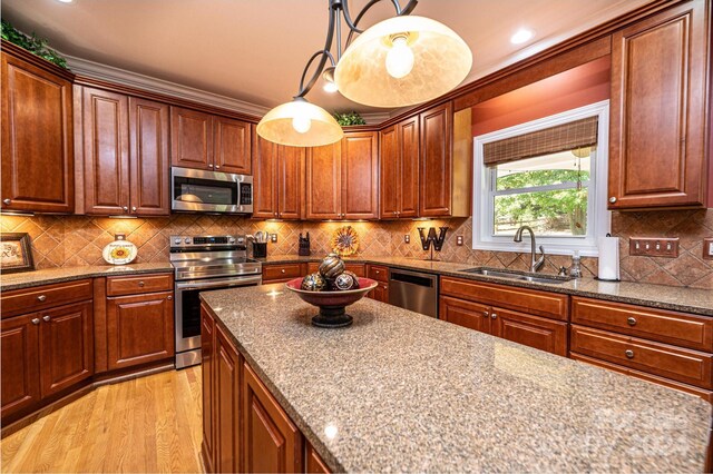 3905 Granite St, Terrell, NC 28682 - kitchen with appliances with stainless steel finishes, a sink, light wood finished floors, dark stone counters, and recessed lighting