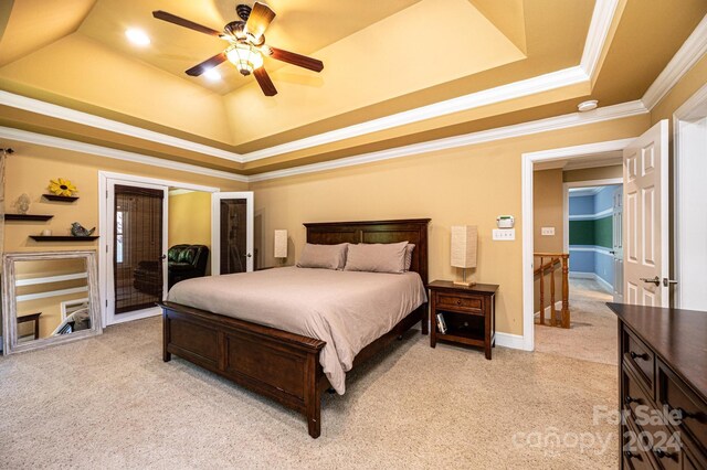 3905 Granite St, Terrell, NC 28682 - bedroom with a tray ceiling, light carpet, crown molding, ceiling fan, and baseboards