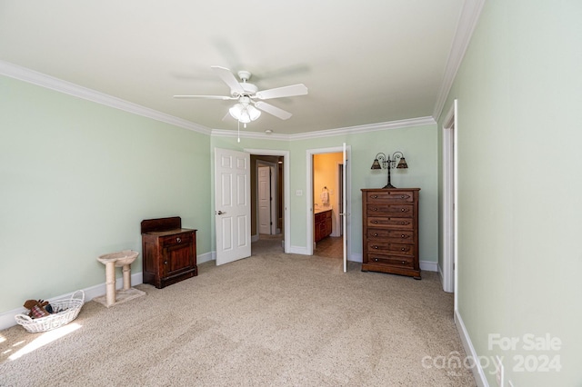 unfurnished bedroom featuring ceiling fan, ensuite bath, crown molding, and light colored carpet