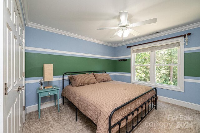 3905 Granite St, Terrell, NC 28682 - carpeted bedroom featuring crown molding, ceiling fan, and baseboards