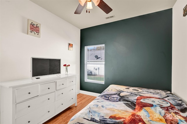 bedroom featuring ceiling fan and light wood-type flooring