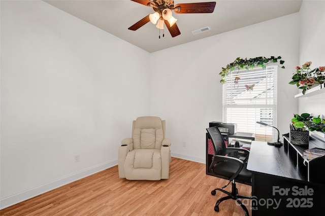 office space featuring ceiling fan and light hardwood / wood-style flooring