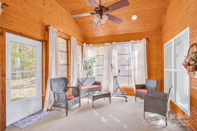 sunroom with ceiling fan, lofted ceiling, and wooden ceiling