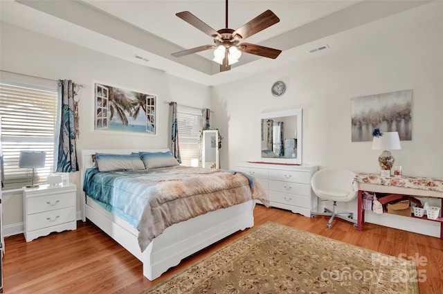 bedroom with hardwood / wood-style floors and ceiling fan