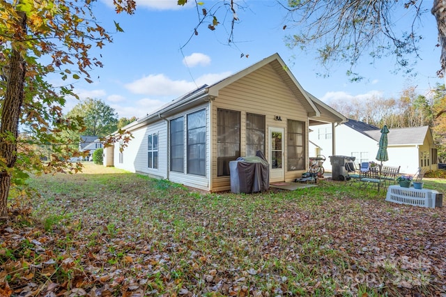 rear view of house with a sunroom