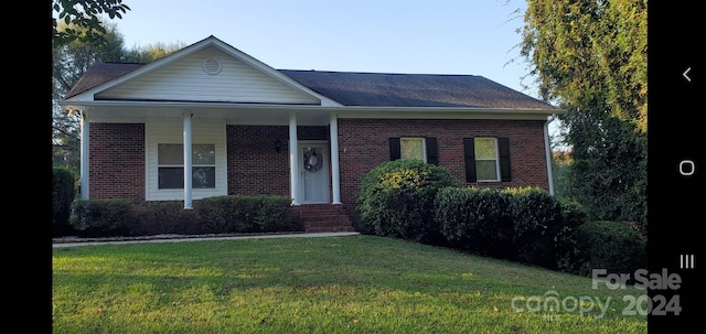 ranch-style house featuring a front lawn