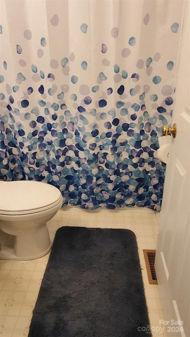 bathroom featuring toilet