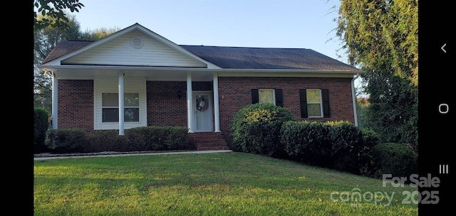 view of front facade with a front lawn and brick siding