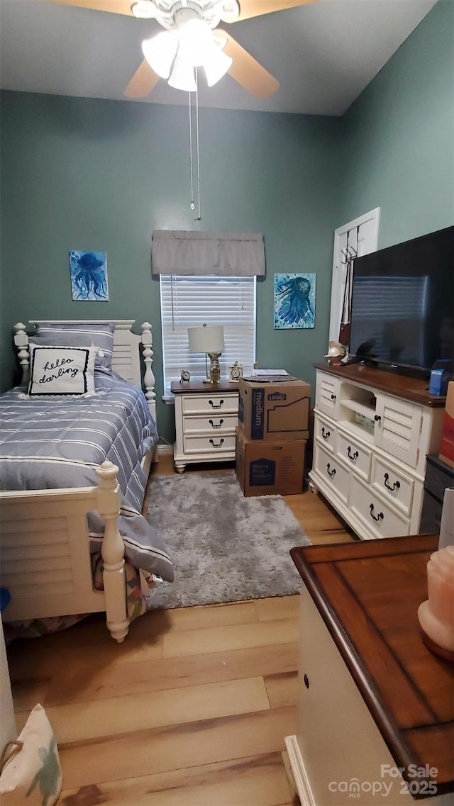 bedroom featuring wood finished floors and ceiling fan