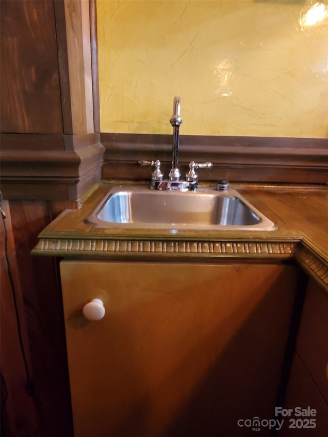 interior details featuring a sink