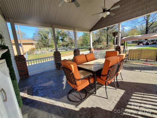 view of patio / terrace featuring outdoor lounge area, ceiling fan, and fence