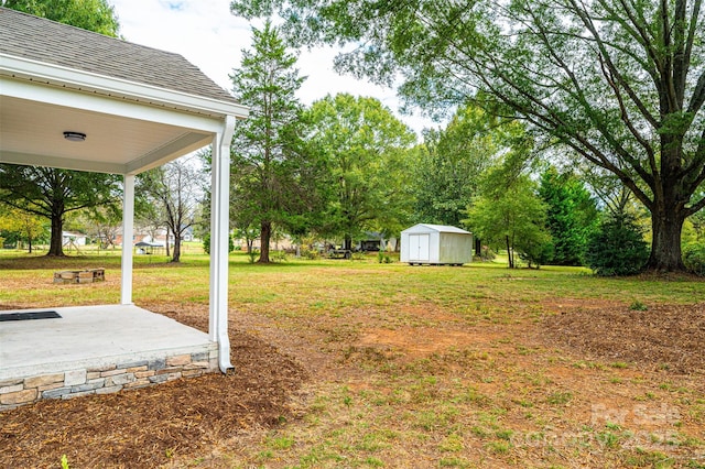 view of yard with a shed and a patio