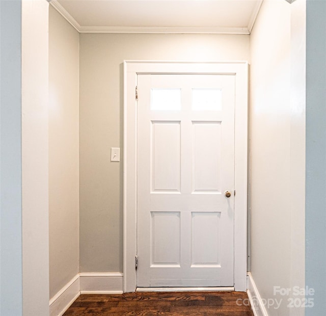 doorway featuring dark hardwood / wood-style floors and ornamental molding