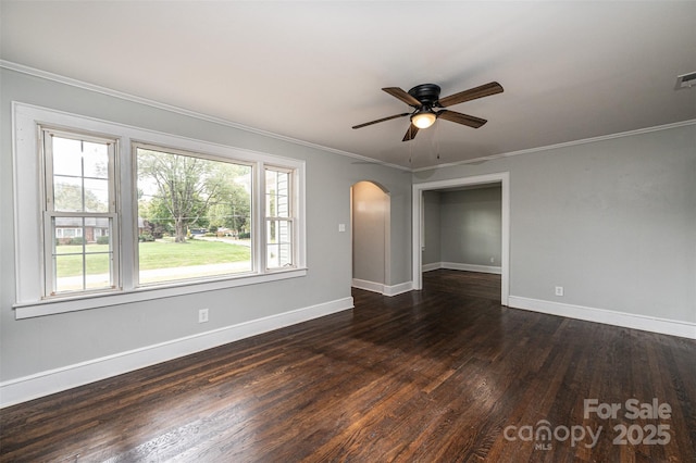 unfurnished room featuring ceiling fan, dark hardwood / wood-style floors, and crown molding