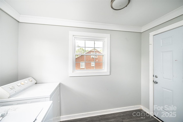 laundry area featuring washer and dryer and ornamental molding