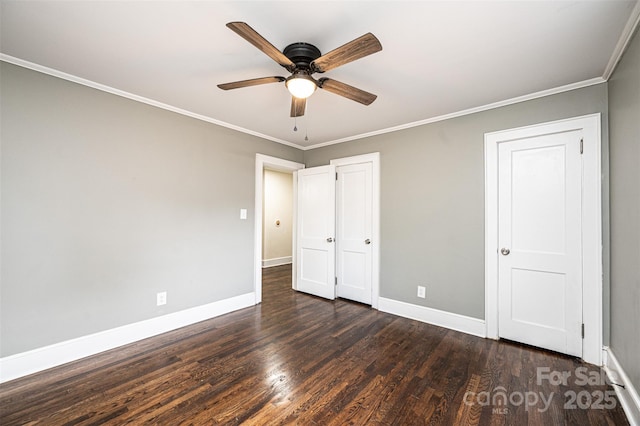 unfurnished bedroom with dark wood-type flooring, ceiling fan, and crown molding