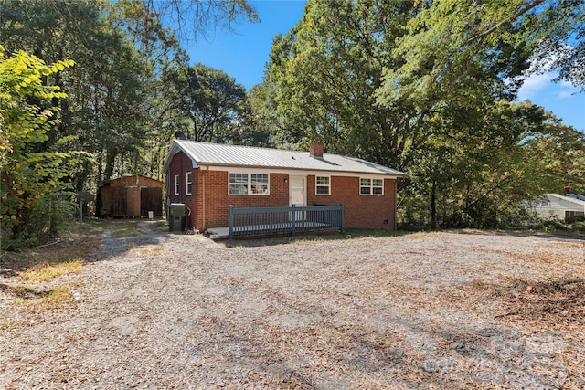 view of front facade featuring a shed