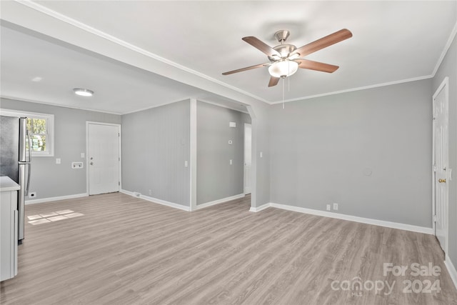 unfurnished room featuring light hardwood / wood-style floors, ornamental molding, and ceiling fan