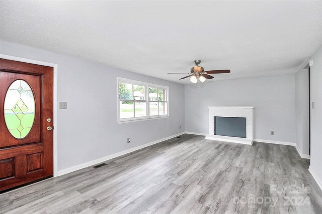 1613 Ohenry Ln, Fort Mill, SC 29708 - entrance foyer with wood finished floors, ceiling fan, and a fireplace