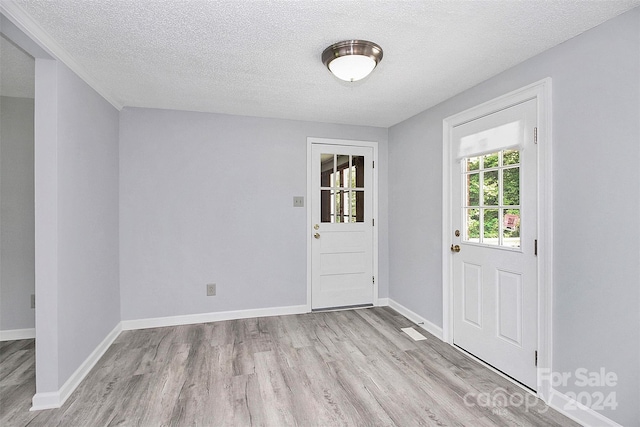 1613 Ohenry Ln, Fort Mill, SC 29708 - doorway to outside with wood finished floors and a textured ceiling