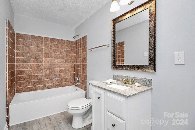 1613 Ohenry Ln, Fort Mill, SC 29708 - full bath with wood finished floors, vanity, tub / shower combination, and a textured ceiling