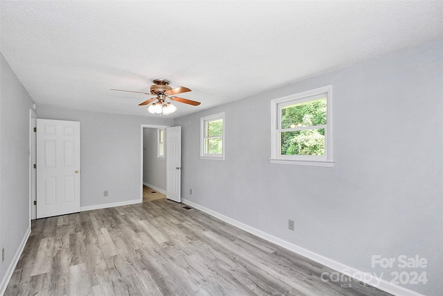 1613 Ohenry Ln, Fort Mill, SC 29708 - unfurnished bedroom featuring wood finished floors and a ceiling fan