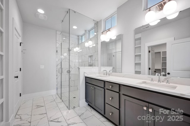 bathroom featuring vanity and a shower with shower door