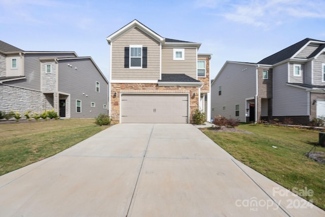 front facade with a garage and a front yard