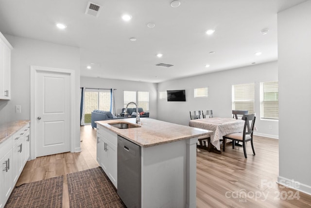 kitchen with white cabinetry, sink, an island with sink, light hardwood / wood-style floors, and dishwasher