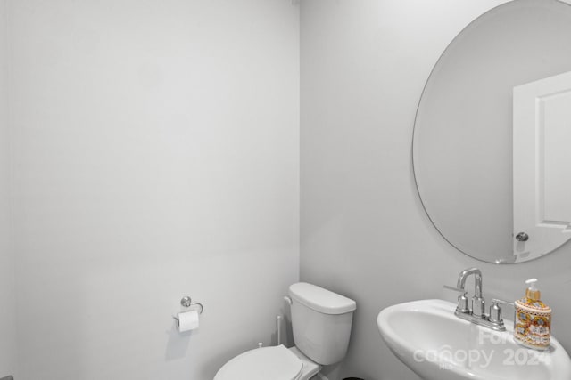 bathroom with sink and toilet