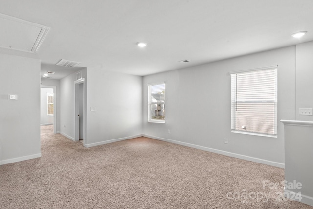 empty room featuring light colored carpet