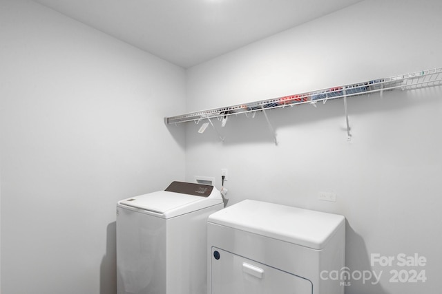 laundry room with independent washer and dryer